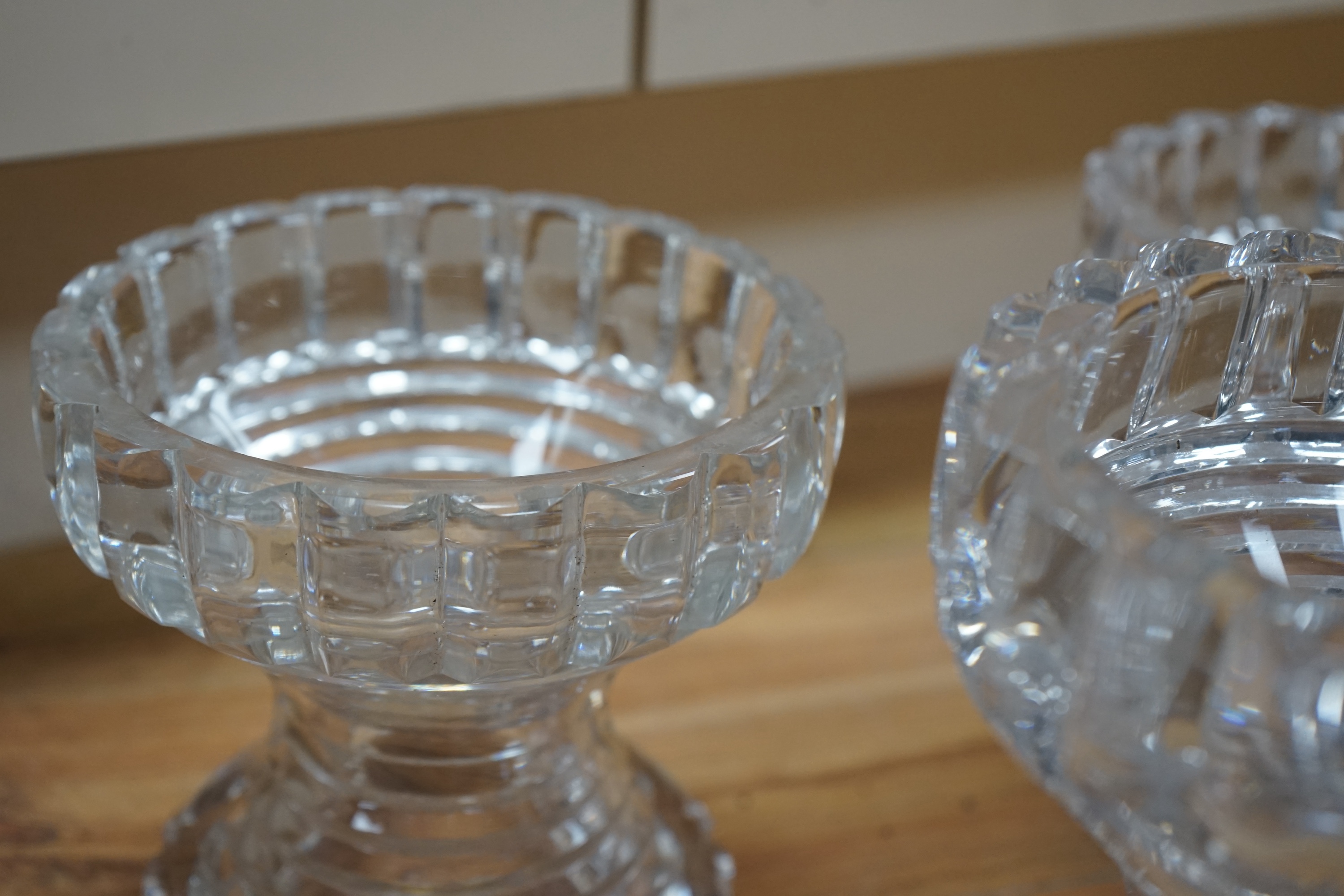 A set of three Regency cut glass pineapple stands, 19cm. Condition - several chips